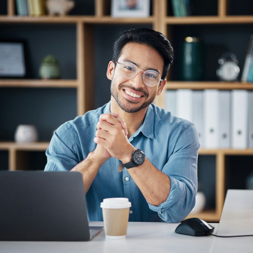 Asian man, portrait smile and laptop of financial advisor in small business or networking at office Asian man, portrait smile and laptop of financial advisor in small business or networking at office